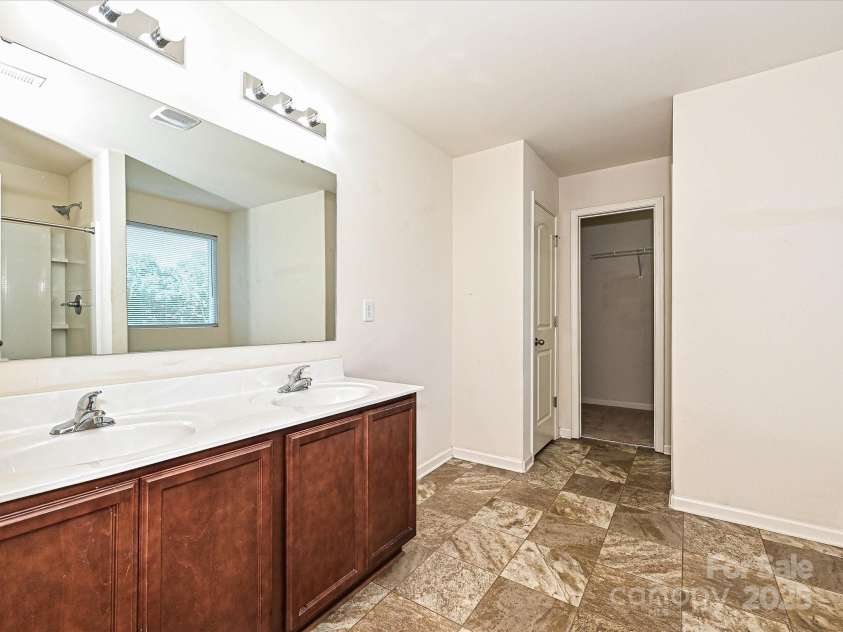 104 Mulligan Drive, Shelby, NC 28150.  MLS# CAR4241594, YatesRealty ID 11728. Primary bathroom with double vanity sinks