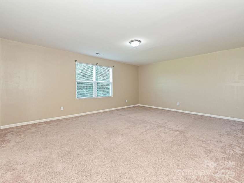 104 Mulligan Drive, Shelby, NC 28150.  MLS# CAR4241594, YatesRealty ID 11728. Spacious Primary Bedroom