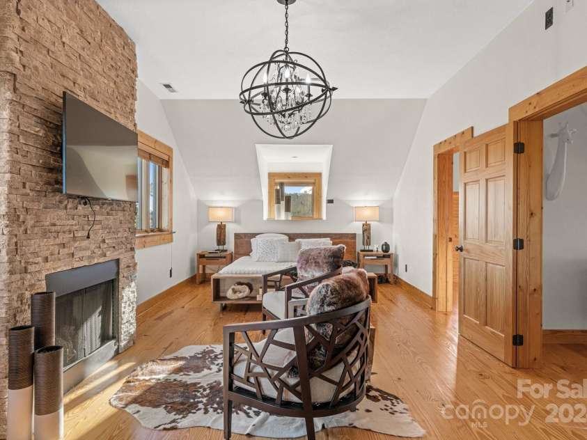 138 Silver Tree Lane, Lake Lure, NC 28746.  MLS# CAR4197152, YatesRealty ID 1173. Primary Bedroom with Fireplace