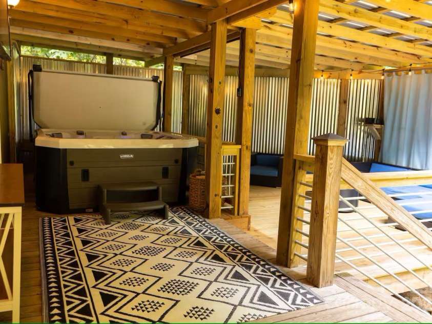 21 Sassafras Drive, Bryson City, NC 28713.  MLS# CAR4257168, YatesRealty ID 11732. Hot Tub out Primary Bedroom Door