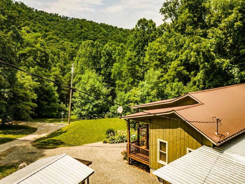 21 Sassafras Drive, Bryson City, NC 28713.  MLS# CAR4257168, YatesRealty ID 11732. Looking across the front yard