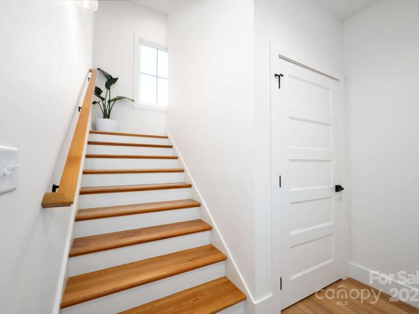 103 Pennsylvania Avenue, Asheville, NC 28806.  MLS# CAR4249512, YatesRealty ID 11734. Lower Level Stairs