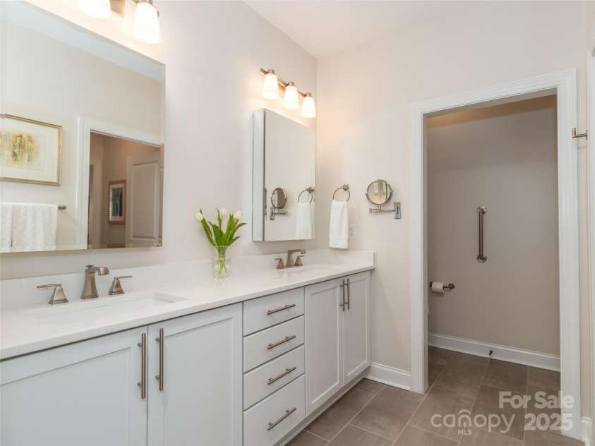 2342 Wesley Landing Road, Waxhaw, NC 28173.  MLS# CAR4238827, YatesRealty ID 11736. Primary bath with mirrored medicine cabinets