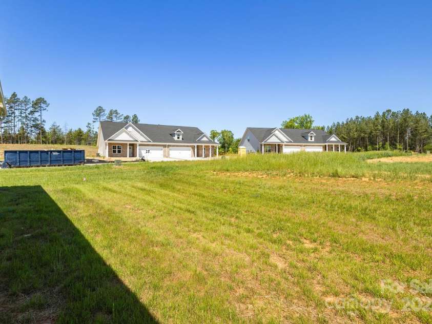 301 Beeson Court, Clemmons, NC 27012.  MLS# CAR4254777, YatesRealty ID 11740. Side Yard
