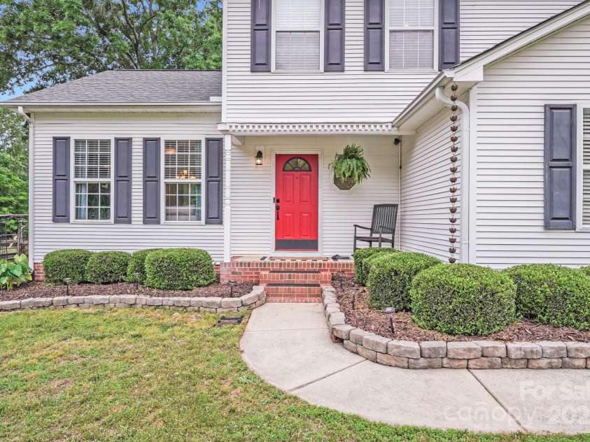 6910 Birdsong Lane, Waxhaw, NC 28173.  MLS# CAR4253788, YatesRealty ID 11745. A bold red door is a symbol of warmth and hospitality!