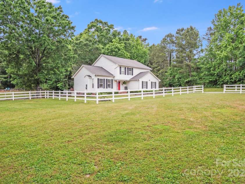 6910 Birdsong Lane, Waxhaw, NC 28173.  MLS# CAR4253788, YatesRealty ID 11745. Beautiful mature horse pasture towards the front of the property