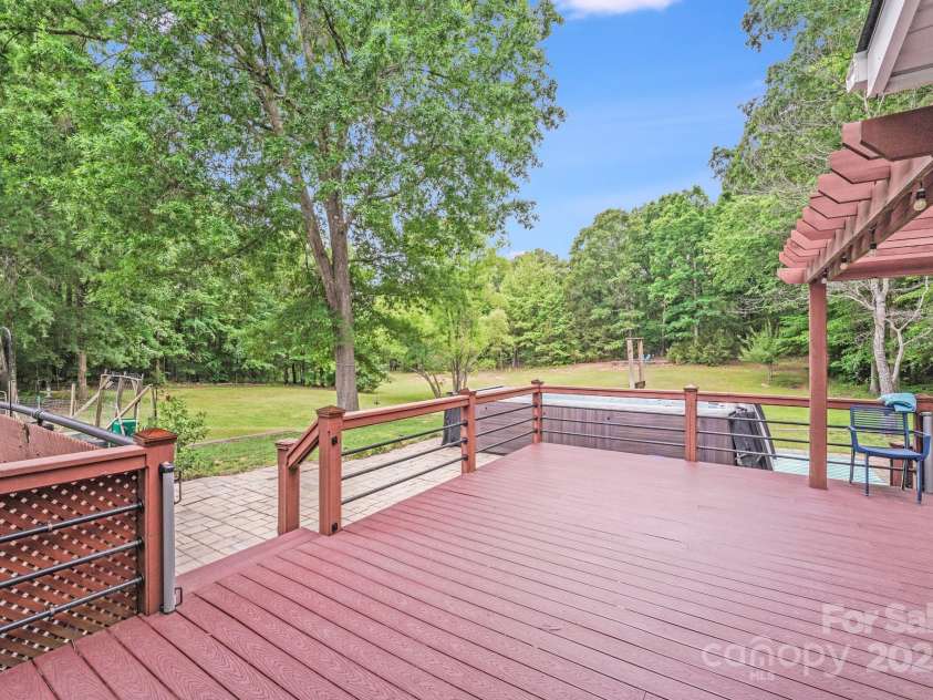 6910 Birdsong Lane, Waxhaw, NC 28173.  MLS# CAR4253788, YatesRealty ID 11745. Low-maintenance Trex deck designed for style and durability