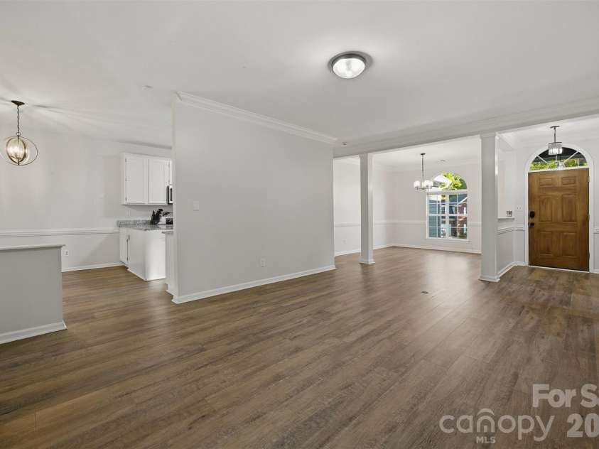 10008 Prosperity Point Lane, Charlotte, NC 28269.  MLS# CAR4362897, YatesRealty ID 11746. Looking at front door from fireplace