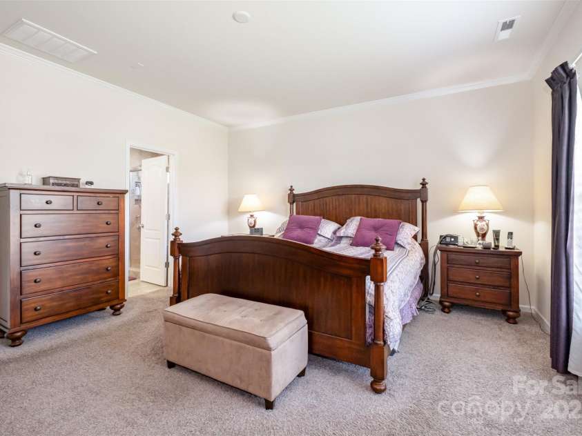 2598 Bryant Drive, Fort Mill, SC 29707.  MLS# CAR4291514, YatesRealty ID 11749. Main level primary bedroom