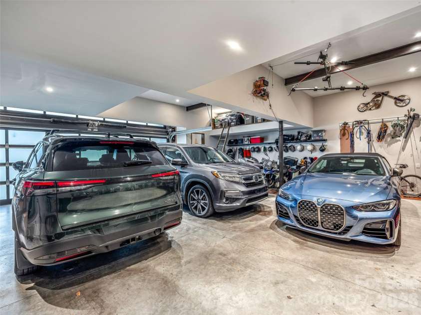 112 Moon Shadow Lane, Marshall, NC 28753.  MLS# CAR4332984, YatesRealty ID 1175. 3+ car garage with room for all your toys! Plumbed for possible dog bath or car washing, ready for EV Charging and has storage in the open loft area!