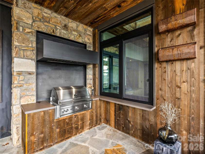 112 Moon Shadow Lane, Marshall, NC 28753.  MLS# CAR4332984, YatesRealty ID 1175. Convenient pass through window with built-in drawers and cabinets for all grilling needs!