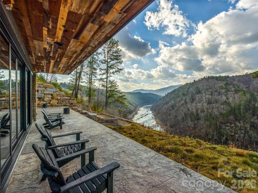112 Moon Shadow Lane, Marshall, NC 28753.  MLS# CAR4332984, YatesRealty ID 1175. Relax on the patio overlooking the river!