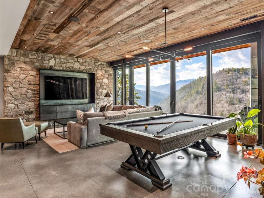 112 Moon Shadow Lane, Marshall, NC 28753.  MLS# CAR4332984, YatesRealty ID 1175. Stamped and heated concrete flooring throughout lower level. Views from every room. Enjoy a game of billiards with a view!