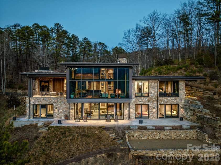 112 Moon Shadow Lane, Marshall, NC 28753.  MLS# CAR4332984, YatesRealty ID 1175. Stone, steel, and concrete, along with the Living Roof blend together to create the perfect balance of comfort, style, and durability.