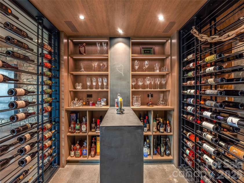 112 Moon Shadow Lane, Marshall, NC 28753.  MLS# CAR4332984, YatesRealty ID 1175. This glass enclosed wine room is a wine enthusiast's dream come true!