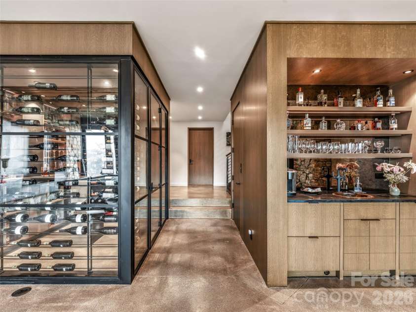 112 Moon Shadow Lane, Marshall, NC 28753.  MLS# CAR4332984, YatesRealty ID 1175. Wine room and a 2nd wet bar with sink, beverage drawers, fridge and freezer drawers, and dishwasher. 