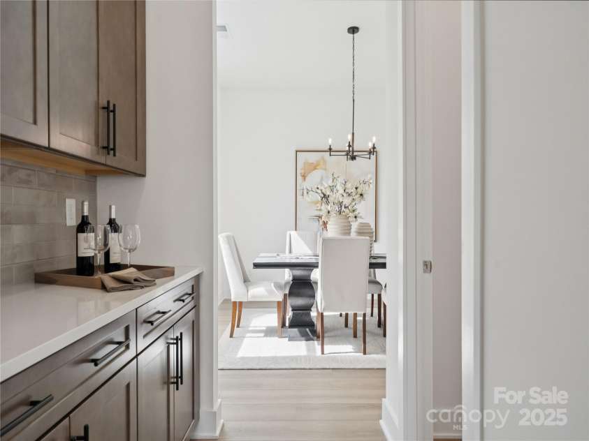 5107 Mint Harbor Way, Charlotte, NC 28269.  MLS# CAR4326148, YatesRealty ID 11754. Butler pantry and dining room