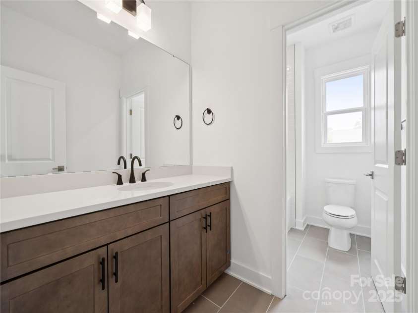 5107 Mint Harbor Way, Charlotte, NC 28269.  MLS# CAR4326148, YatesRealty ID 11754. Guest bath 