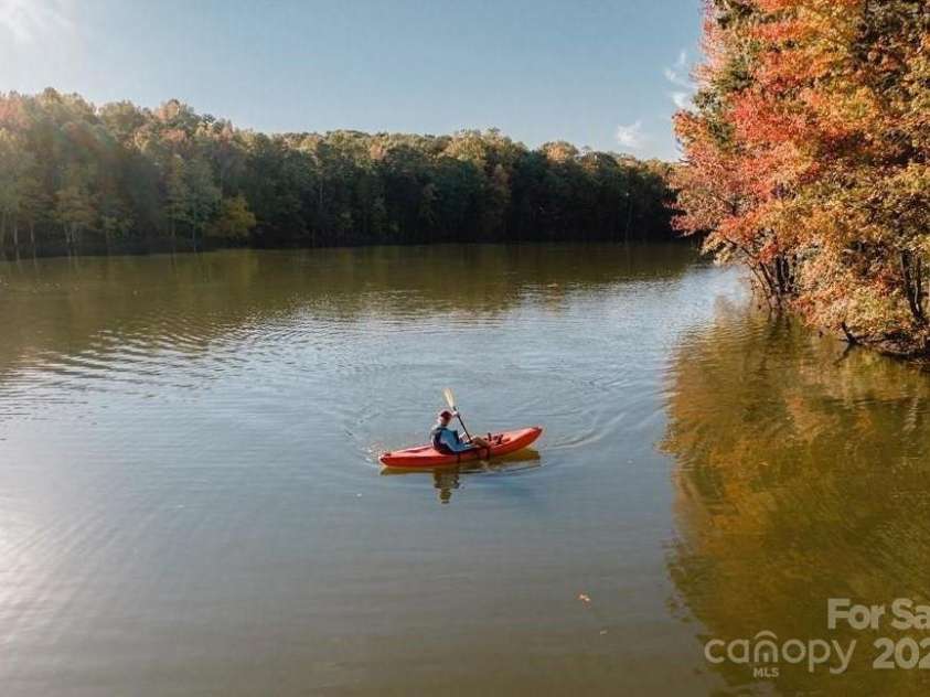 5107 Mint Harbor Way, Charlotte, NC 28269.  MLS# CAR4326148, YatesRealty ID 11754. The private 17-acre Griffith lake in the community offers endless recreation—from kayaking and canoeing to peaceful catch-and-release fishing.
