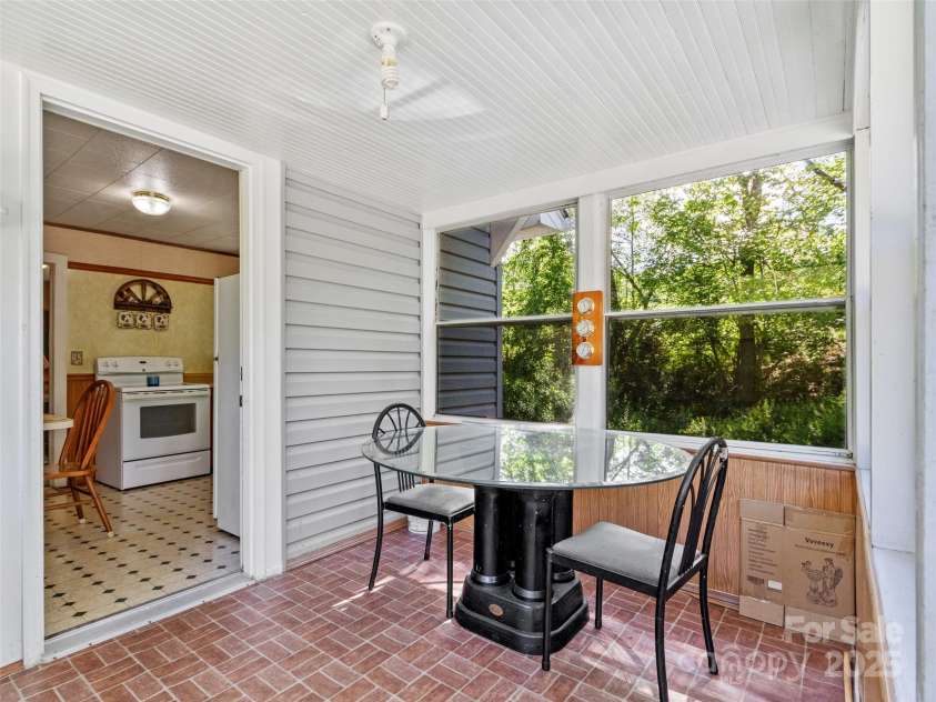 43 Charter Way, Burnsville, NC 28714.  MLS# CAR4256306, YatesRealty ID 11763. Enclosed rear porch