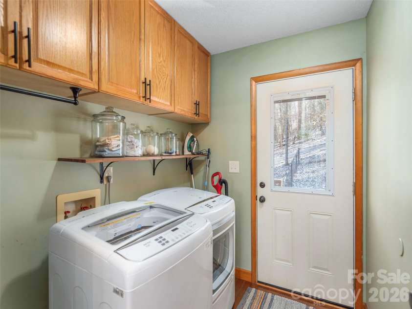 56 Southwicke Drive, Arden, NC 28704.  MLS# CAR4368299, YatesRealty ID 11771. Main level Laundry and mudroom