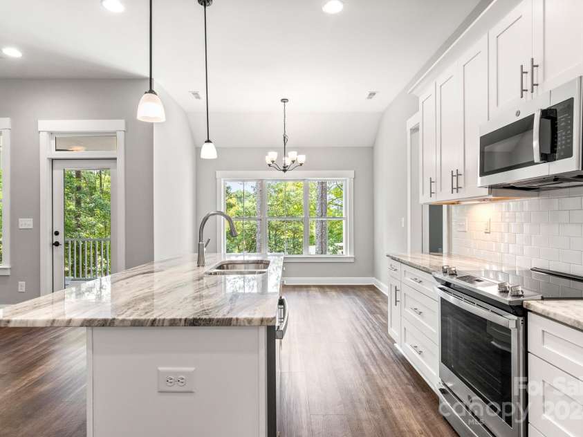 121 Arboretum Way, Shelby, NC 28152.  MLS# CAR4133112, YatesRealty ID 11777. View from kitchen to dining area and back patio