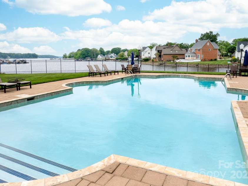 7220 Swansea Lane, Cornelius, NC 28031.  MLS# CAR4255179, YatesRealty ID 11778. Community Pool with Lake Views