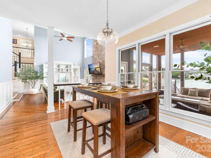 7220 Swansea Lane, Cornelius, NC 28031.  MLS# CAR4255179, YatesRealty ID 11778. Kitchen Dining Area with Lake Views