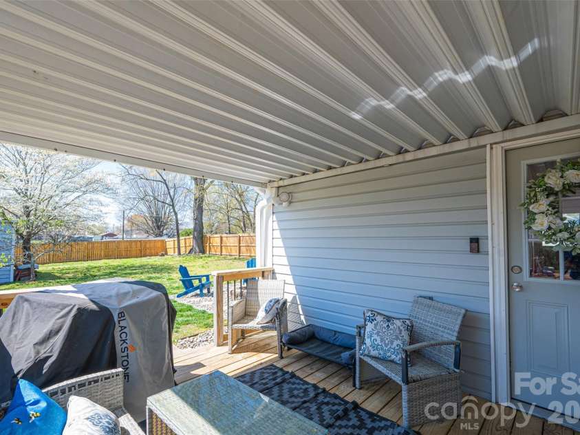 206 Bates Avenue, Cherryville, NC 28021.  MLS# CAR4358580, YatesRealty ID 11779. Covered back porch deck