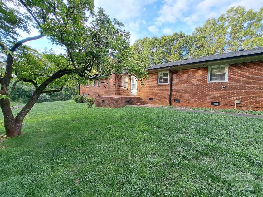 123 Softwind Lane, Concord, NC 28025.  MLS# CAR4296194, YatesRealty ID 1178. Back of house