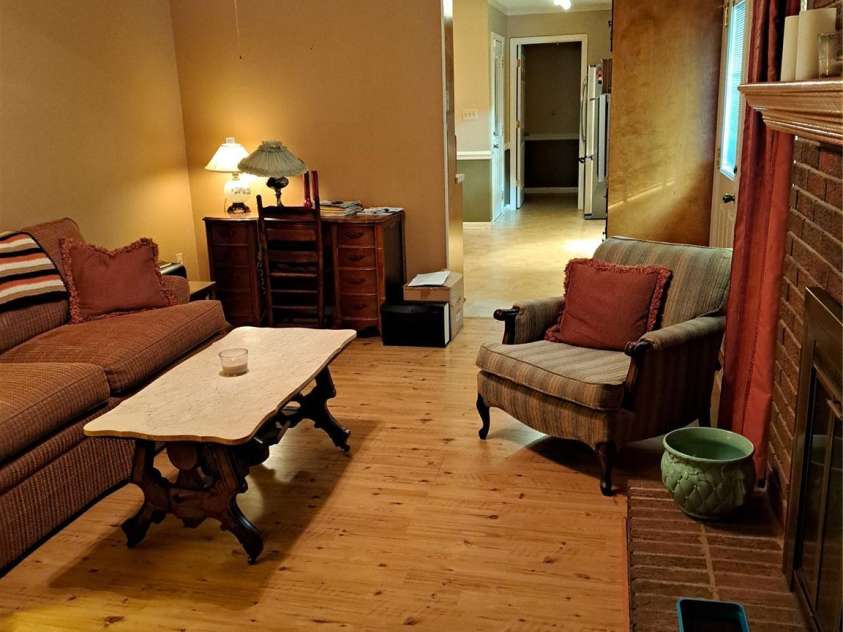 123 Softwind Lane, Concord, NC 28025.  MLS# CAR4296194, YatesRealty ID 1178. Den with fireplace