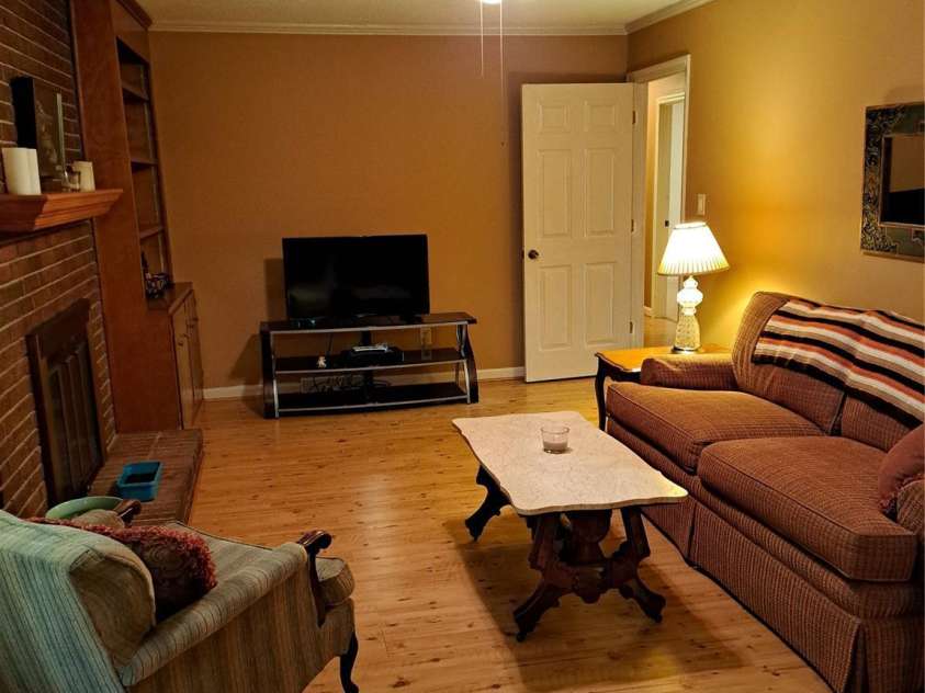 123 Softwind Lane, Concord, NC 28025.  MLS# CAR4296194, YatesRealty ID 1178. Den with fireplace & built-in book case