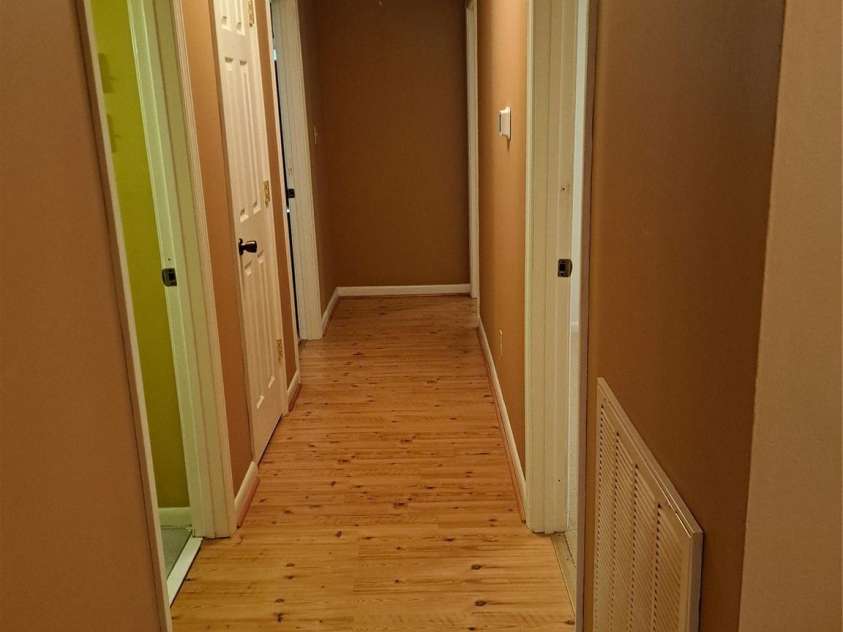 123 Softwind Lane, Concord, NC 28025.  MLS# CAR4296194, YatesRealty ID 1178. Hall to full bath, 2 bedrooms & owner's bedroom with attached full bath