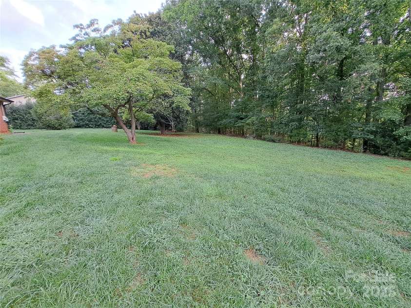 123 Softwind Lane, Concord, NC 28025.  MLS# CAR4296194, YatesRealty ID 1178. VERY Spacious backyard