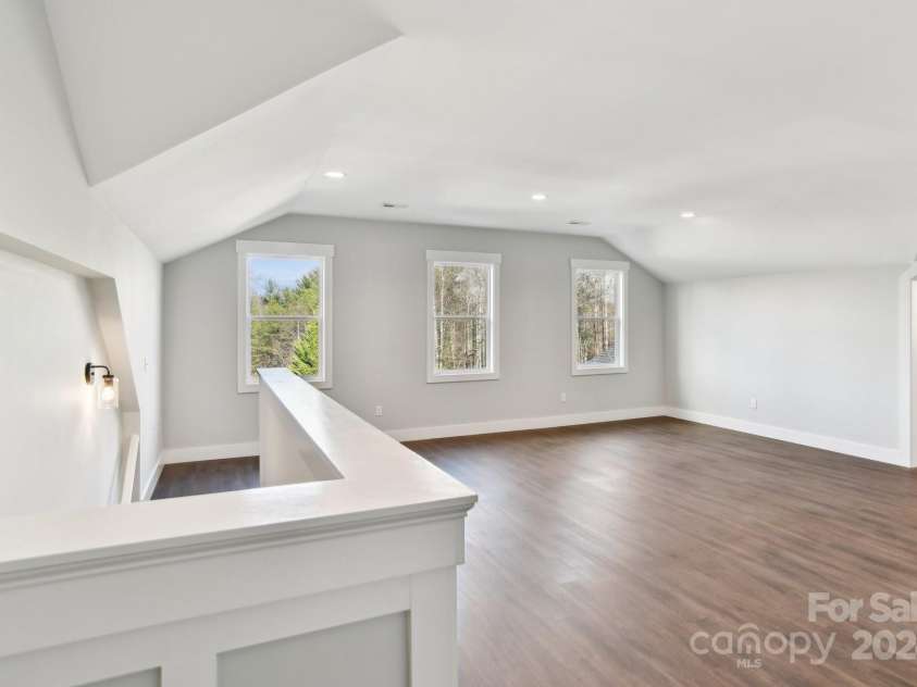 129 Oak Apple Lane, Hendersonville, NC 28792.  MLS# CAR4205968, YatesRealty ID 1178. Second level living room/flex space