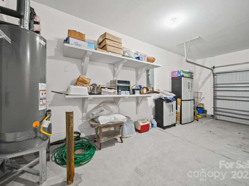 4516 Ideal Way, Harrisburg, NC 28075.  MLS# CAR4325804, YatesRealty ID 1178. Notice all the Built-In Shelves in the Garage