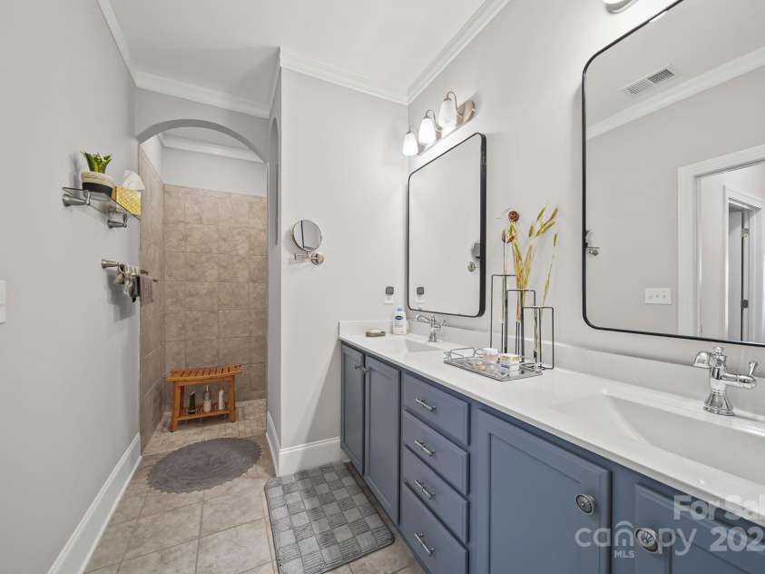 4516 Ideal Way, Harrisburg, NC 28075.  MLS# CAR4325804, YatesRealty ID 1178. The Owners Bath Features a Doubled Sink Vanity and Custom Framed Mirrors