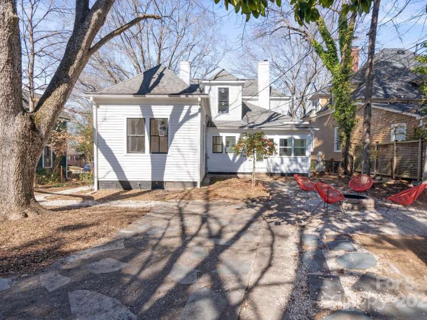 85 Grove Avenue, Concord, NC 28025.  MLS# CAR4224085, YatesRealty ID 11785. Courtyard For Gatherings w/mature trees , a firepit & beautiful flowers that bloom through all the seasons