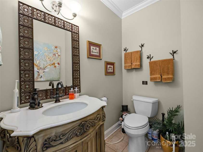 410 Lamp Post Drive, Zirconia, NC 28790.  MLS# CAR4253255, YatesRealty ID 11787. Half bath in foyer