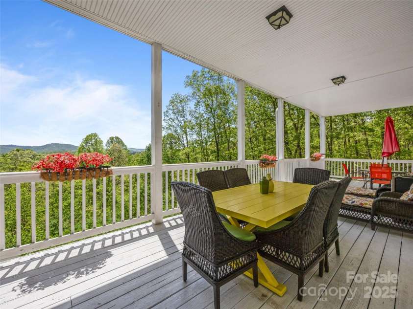 410 Lamp Post Drive, Zirconia, NC 28790.  MLS# CAR4253255, YatesRealty ID 11787. Lower level porch