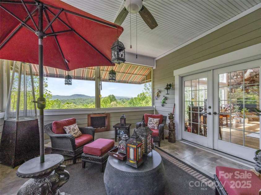 410 Lamp Post Drive, Zirconia, NC 28790.  MLS# CAR4253255, YatesRealty ID 11787. Screened porch off living room