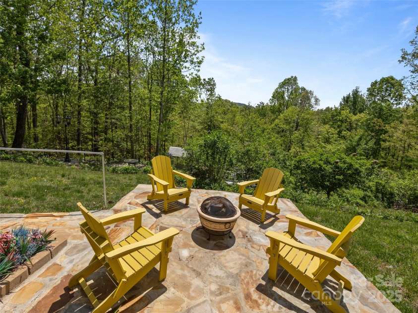 410 Lamp Post Drive, Zirconia, NC 28790.  MLS# CAR4253255, YatesRealty ID 11787. Stone patio with firepit