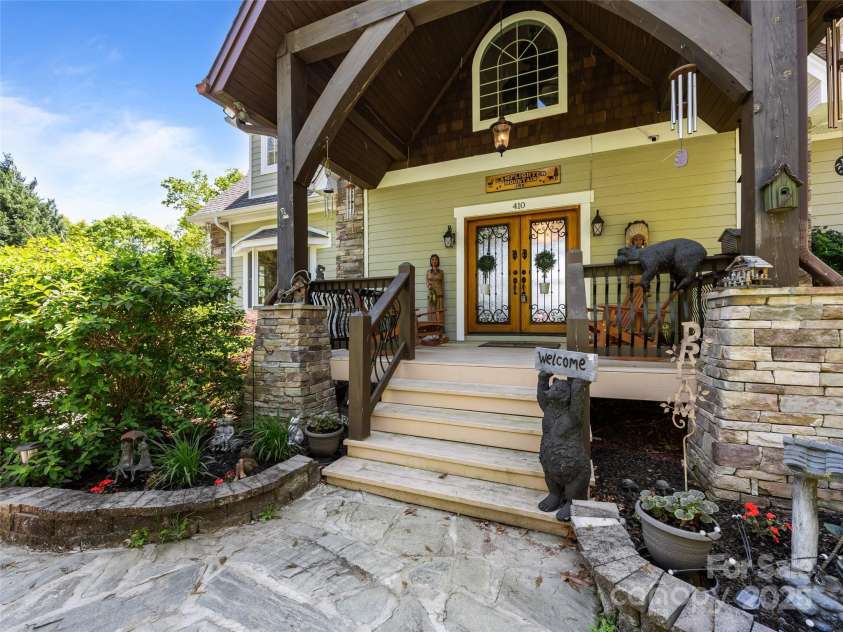410 Lamp Post Drive, Zirconia, NC 28790.  MLS# CAR4253255, YatesRealty ID 11787. Stone walkway to covered front porch