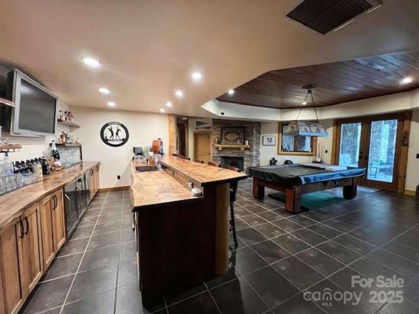 51 Airport Road, Mars Hill, NC 28754.  MLS# CAR4241887, YatesRealty ID 11789. Basement - Full light and floor to ceiling stone-stacked FP