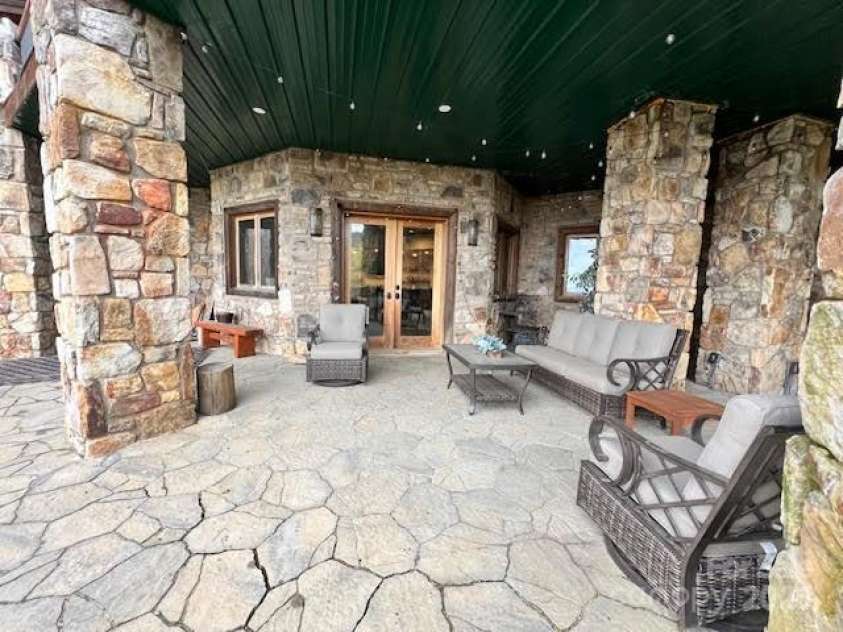 51 Airport Road, Mars Hill, NC 28754.  MLS# CAR4241887, YatesRealty ID 11789. Covered Pato - Rear