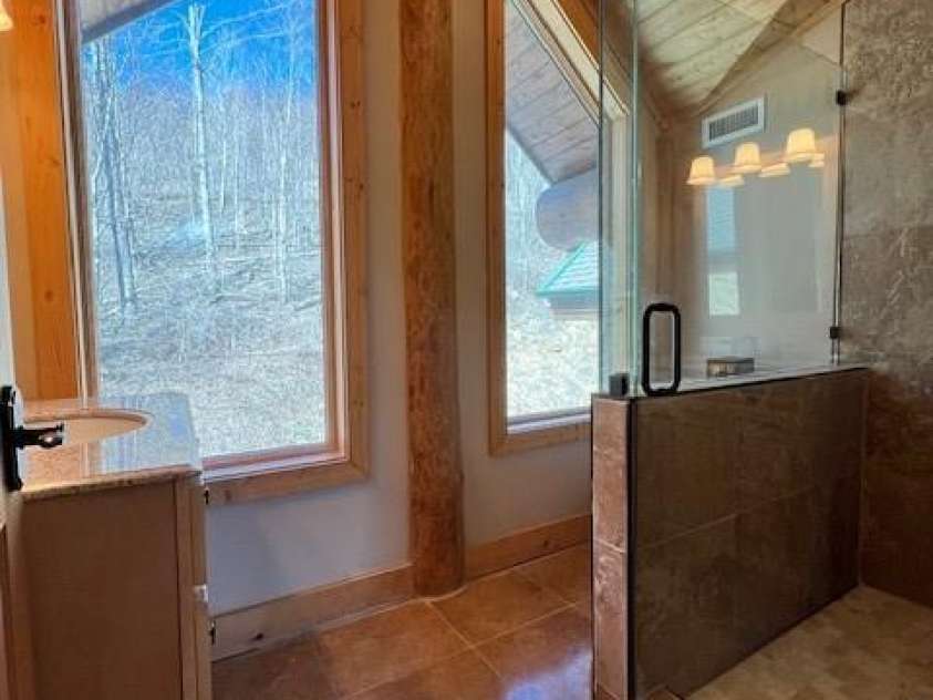 51 Airport Road, Mars Hill, NC 28754.  MLS# CAR4241887, YatesRealty ID 11789. En-suite with glass shower