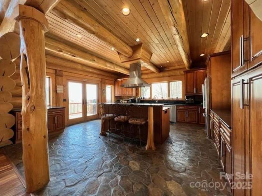 51 Airport Road, Mars Hill, NC 28754.  MLS# CAR4241887, YatesRealty ID 11789. Kitchen island with breakfast bar