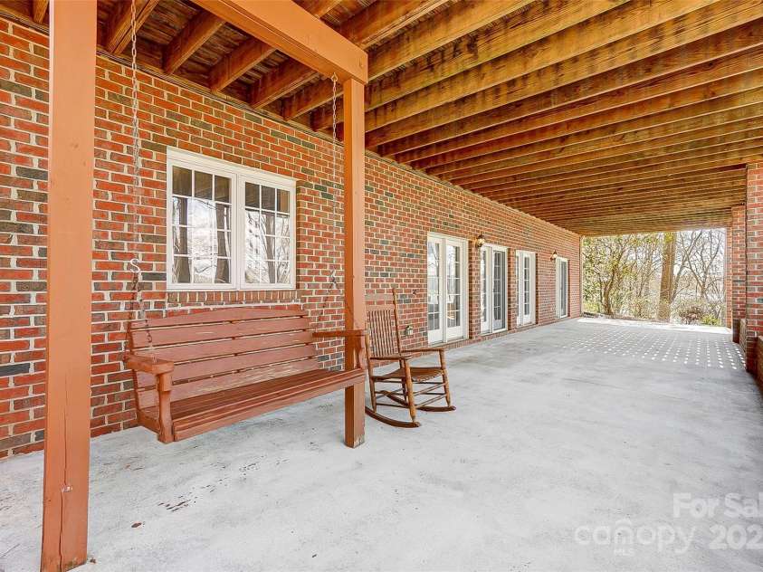 4633 River Bluff Court, Charlotte, NC 28214.  MLS# CAR4235344, YatesRealty ID 11796. Step out to the backyard oasis & enjoy the lakefront living