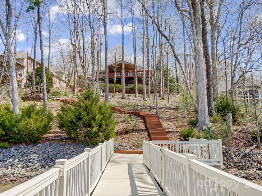 4633 River Bluff Court, Charlotte, NC 28214.  MLS# CAR4235344, YatesRealty ID 11796. The beautifully landscaped yard provides a serene backdrop for outdoor enjoyment