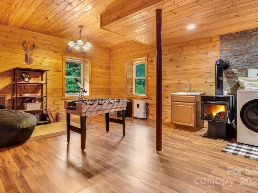 4271 Old Field Creek Road, Grassy Creek, NC 28631.  MLS# CAR4284275, YatesRealty ID 1180. Basement with Fireplace